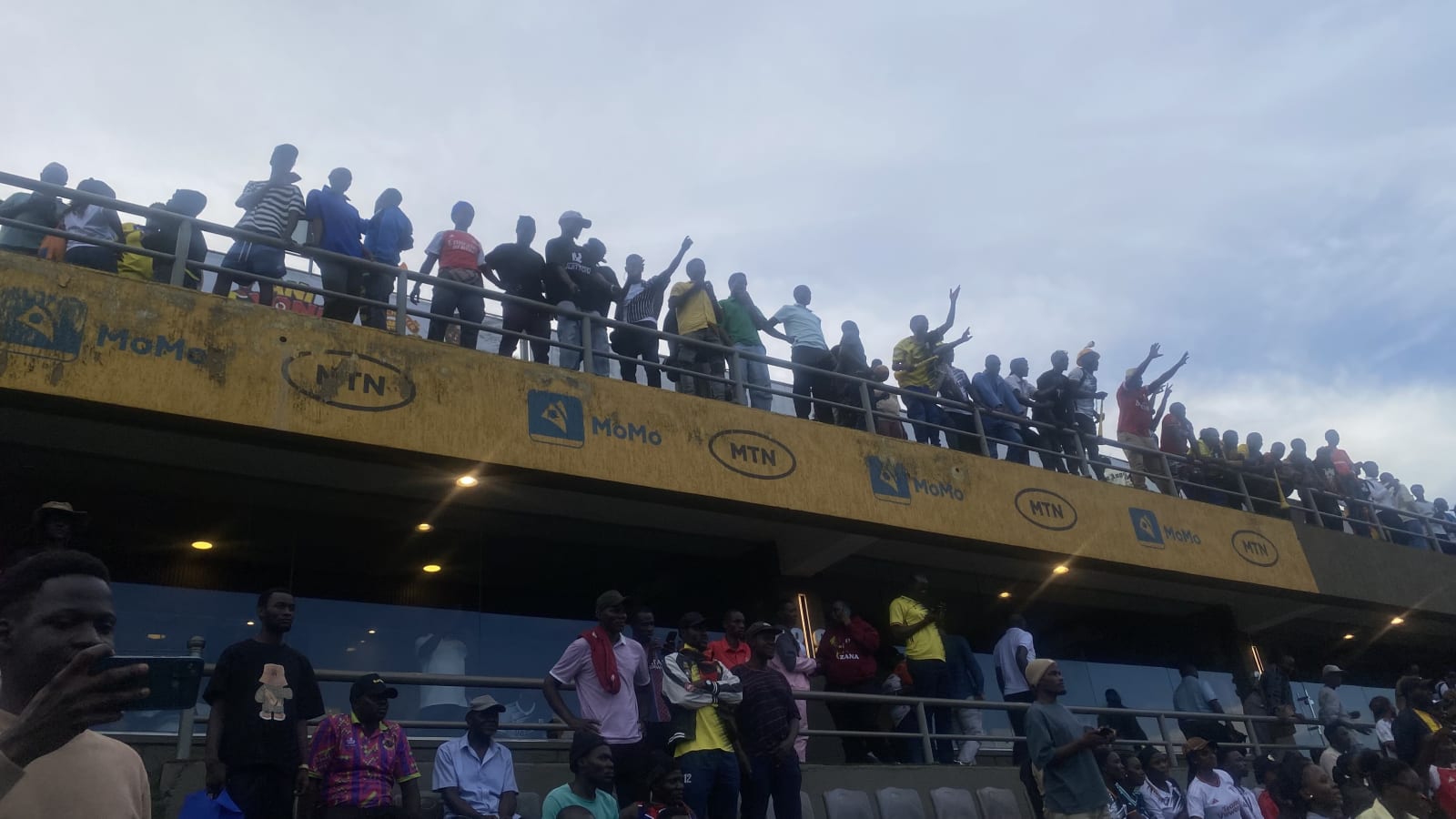 Supporters cheer from the upper stand