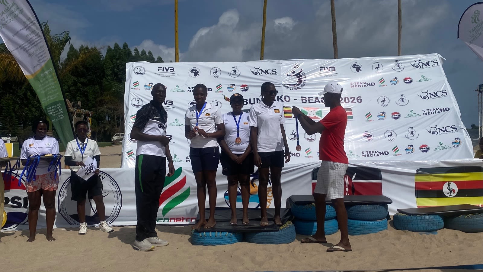 Ugandan pair receiving their medals