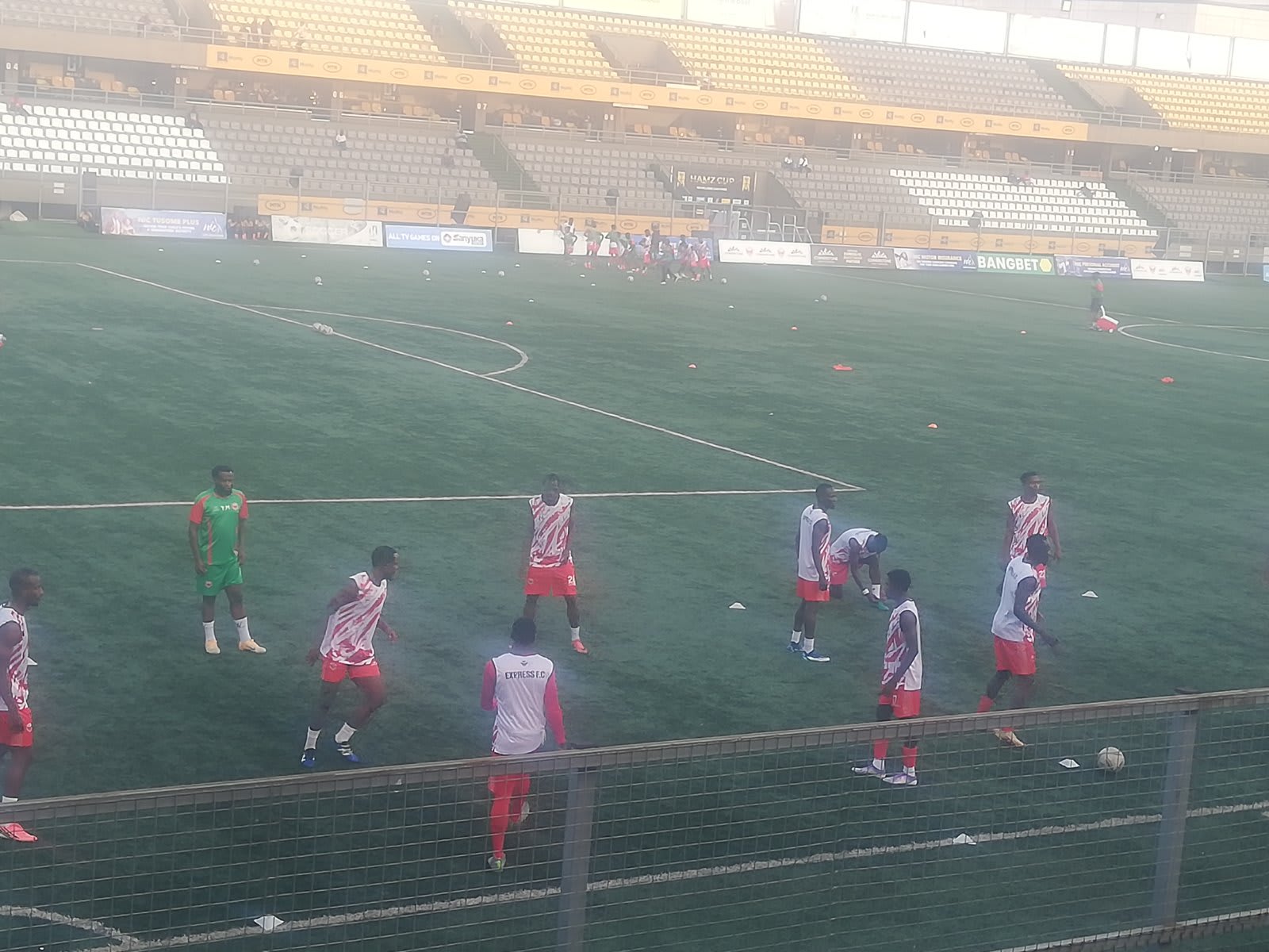 Express fc players warm up for the match