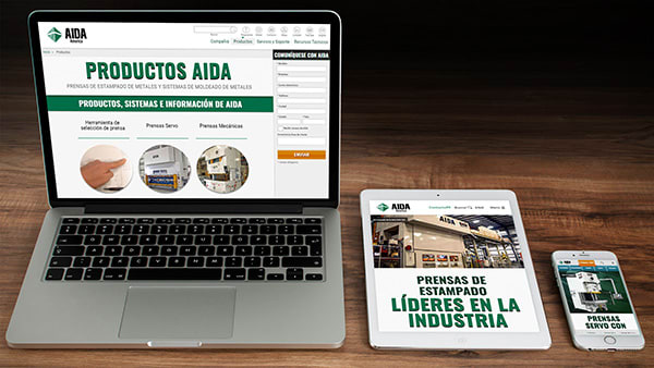 Several devices showing the AIDA-America website in Spanish