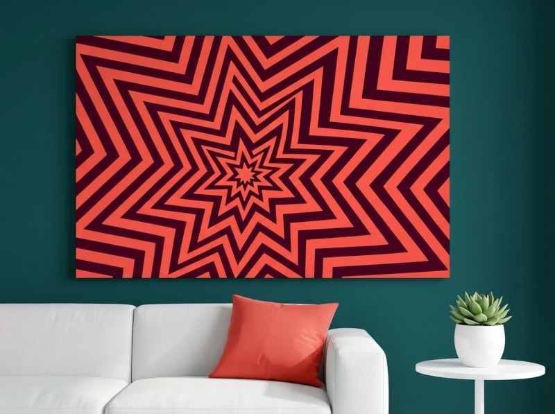 Geometric starburst canvas print in coral red and orange, retro 70s op art style for living room