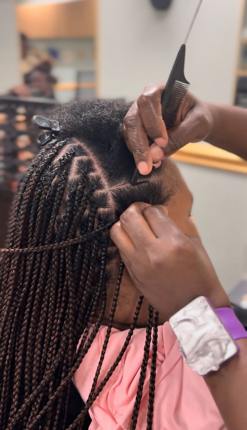 Close-up of precise parts during a knotless braid install