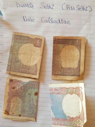 picture of notes from my collection taken 13 years later, at time of writing the article. 3x One Rupee and 1x of two rupees. Placed on a paper with my name as a proof.