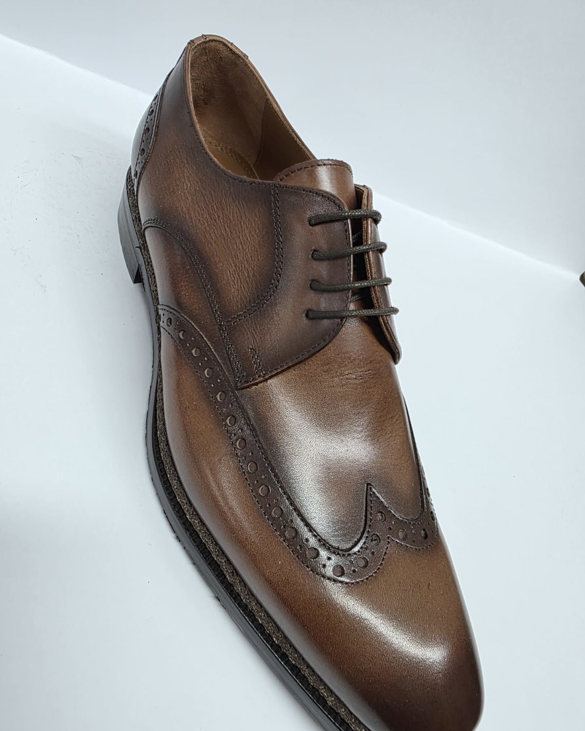 Brown Leather Wingtip Oxford - three-quarter