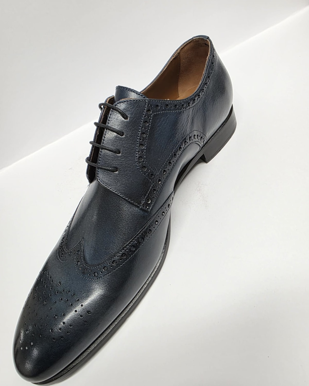 Navy Blue Leather Wingtip Oxford - three-quarter