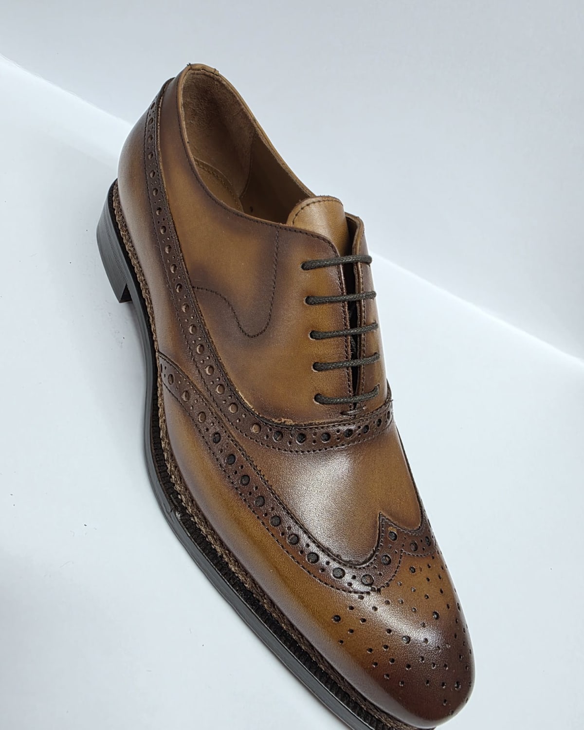 Brown Leather Wingtip Oxford - three-quarter