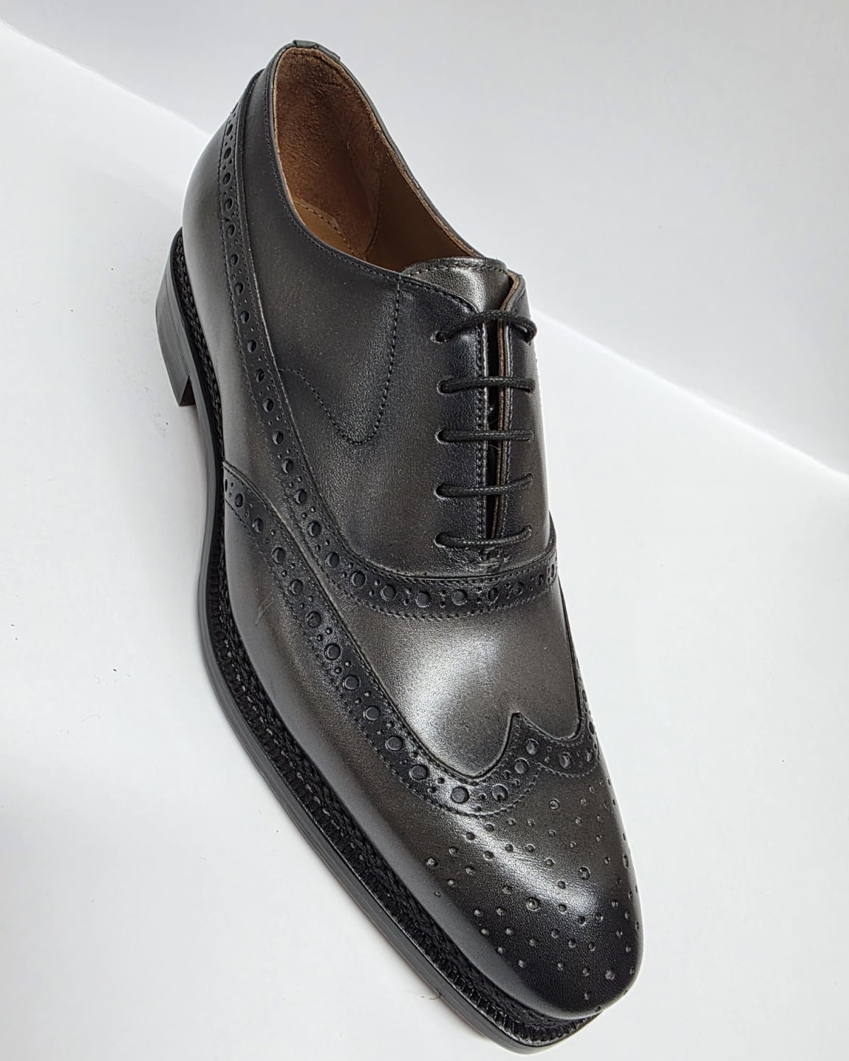 Black Leather Wingtip Oxford - three-quarter