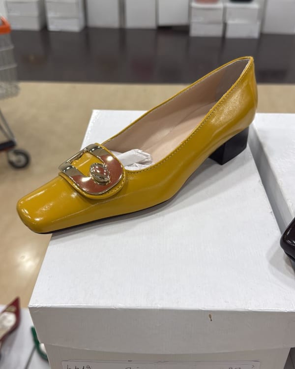 Assorted Women's Heels, Flats, and Men's Suits