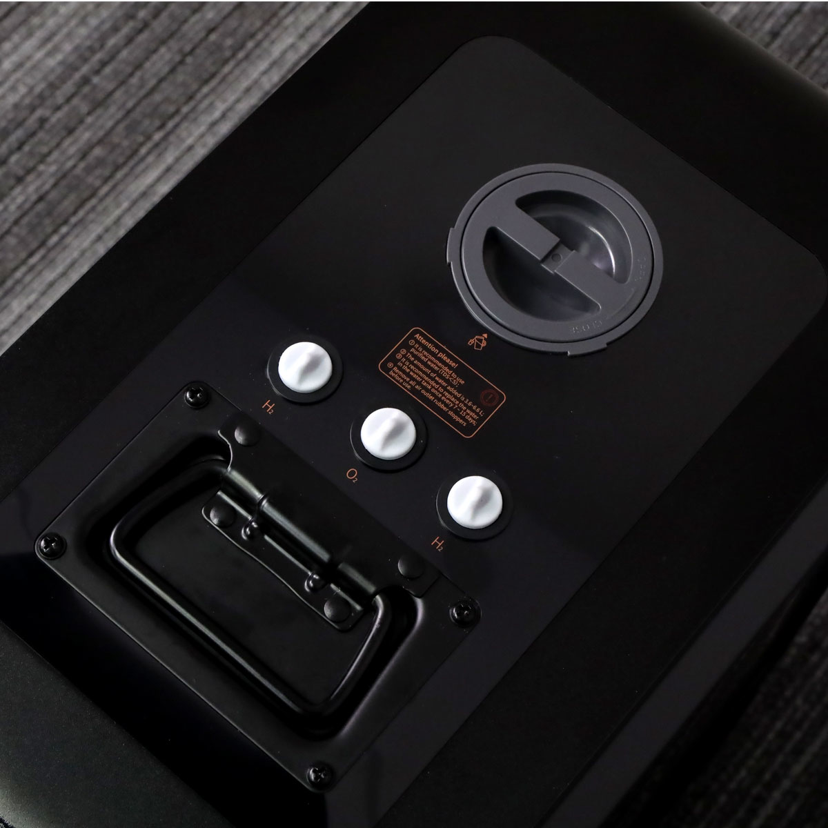 Close-up of the hydrogen and oxygen output ports on top of the Revive Hydrogen generator