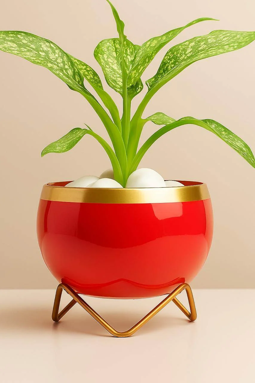 Vibrant Red Metal Planter with Gold Trim and Geometric Stand