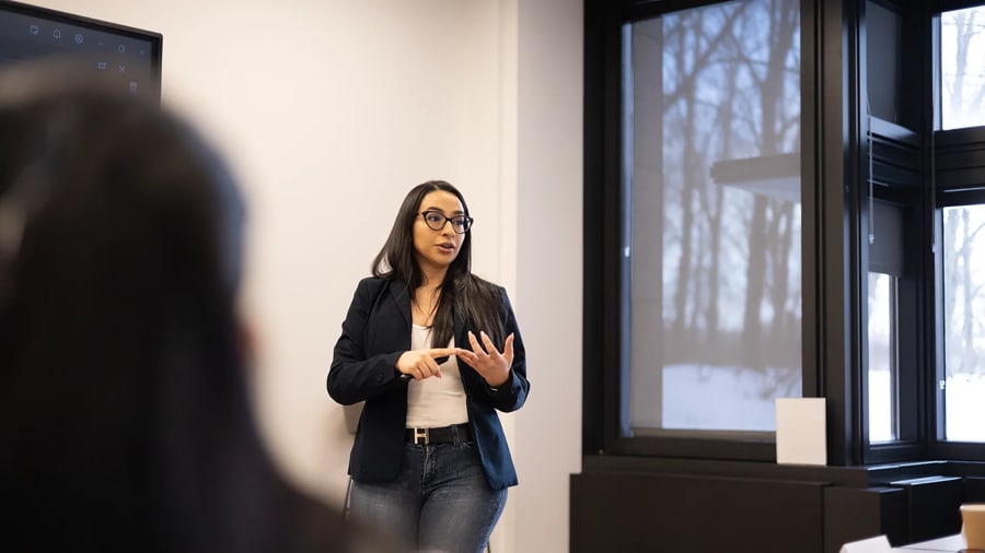 Roofing director helping class.