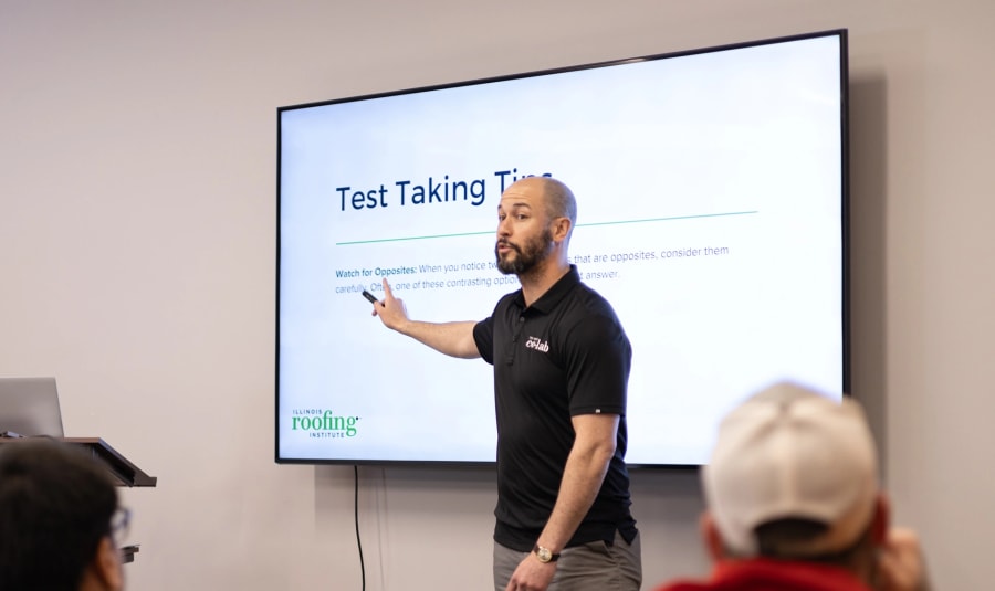 Roofing instructor teaching class.