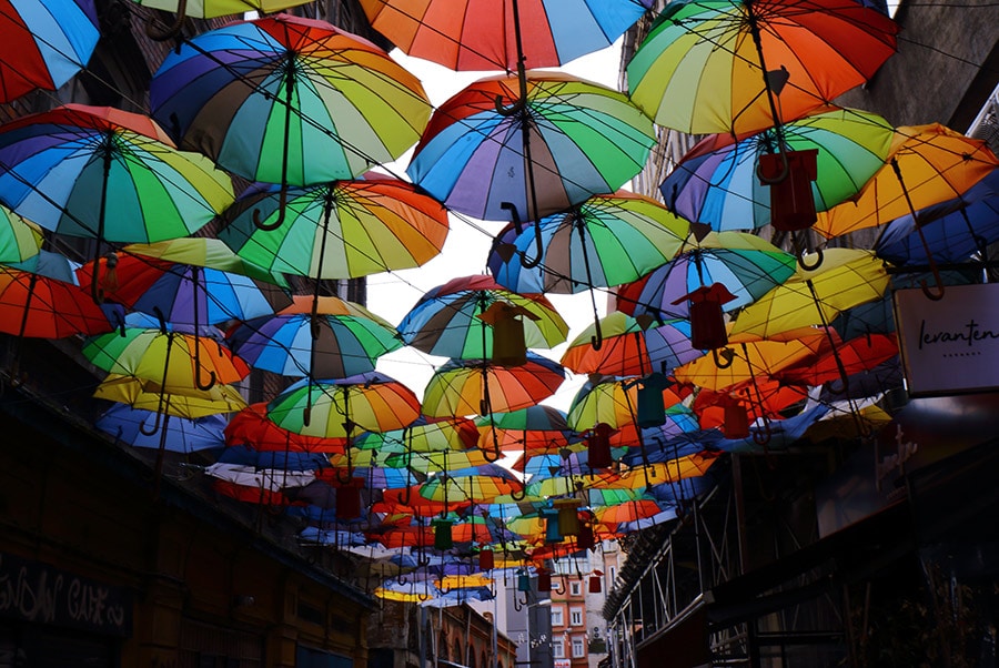 colorful umbrellas covering the street in karakoy