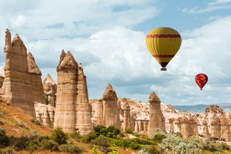 fairy chimneys with hot air balloon in love valley cappadocia