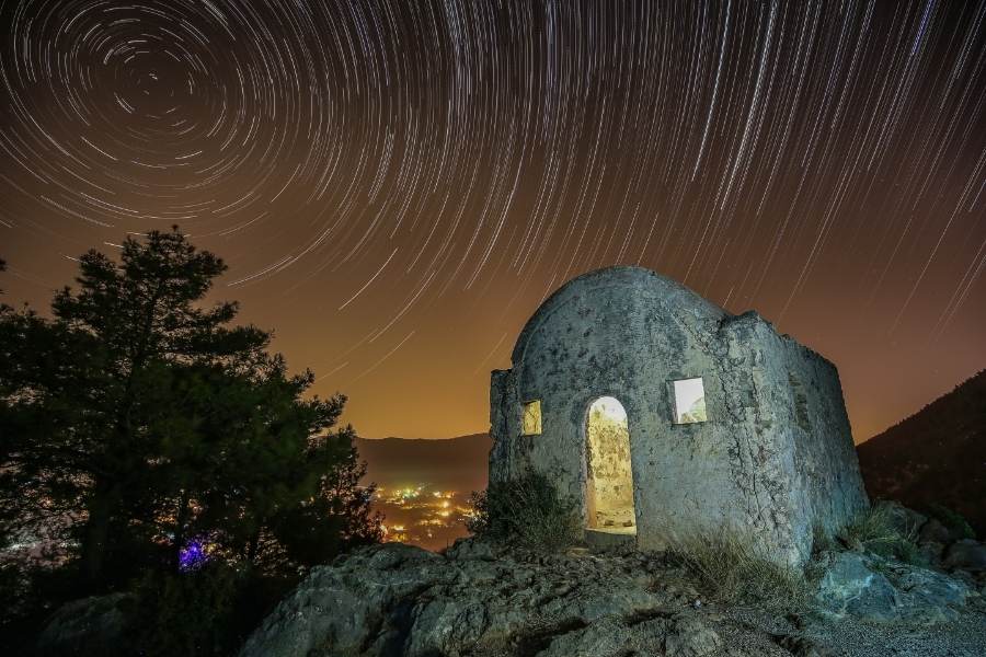 temple ruin on a hilltop in kayaköy at night