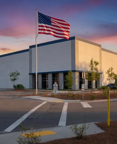 An American flag flying over a GWSI logistics facility