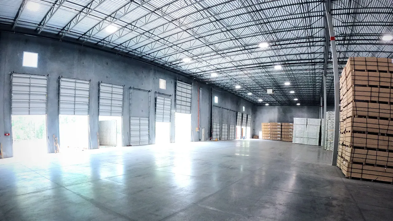 GWSI warehouse interior with trucks loading at the dock