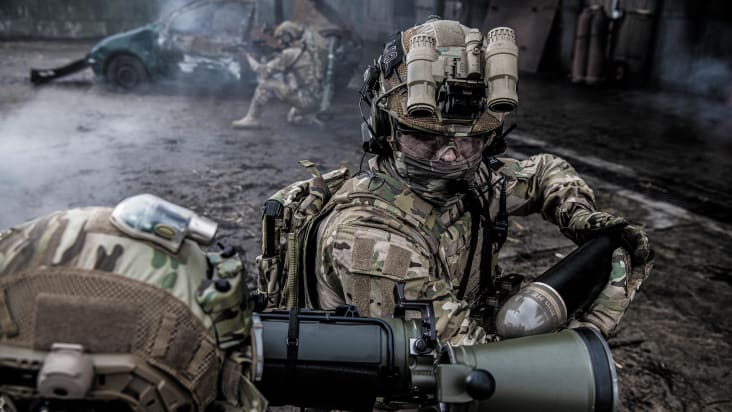 Assistant gunner loading Carl-Gustaf M4 with programmable ammo High Explosive 448