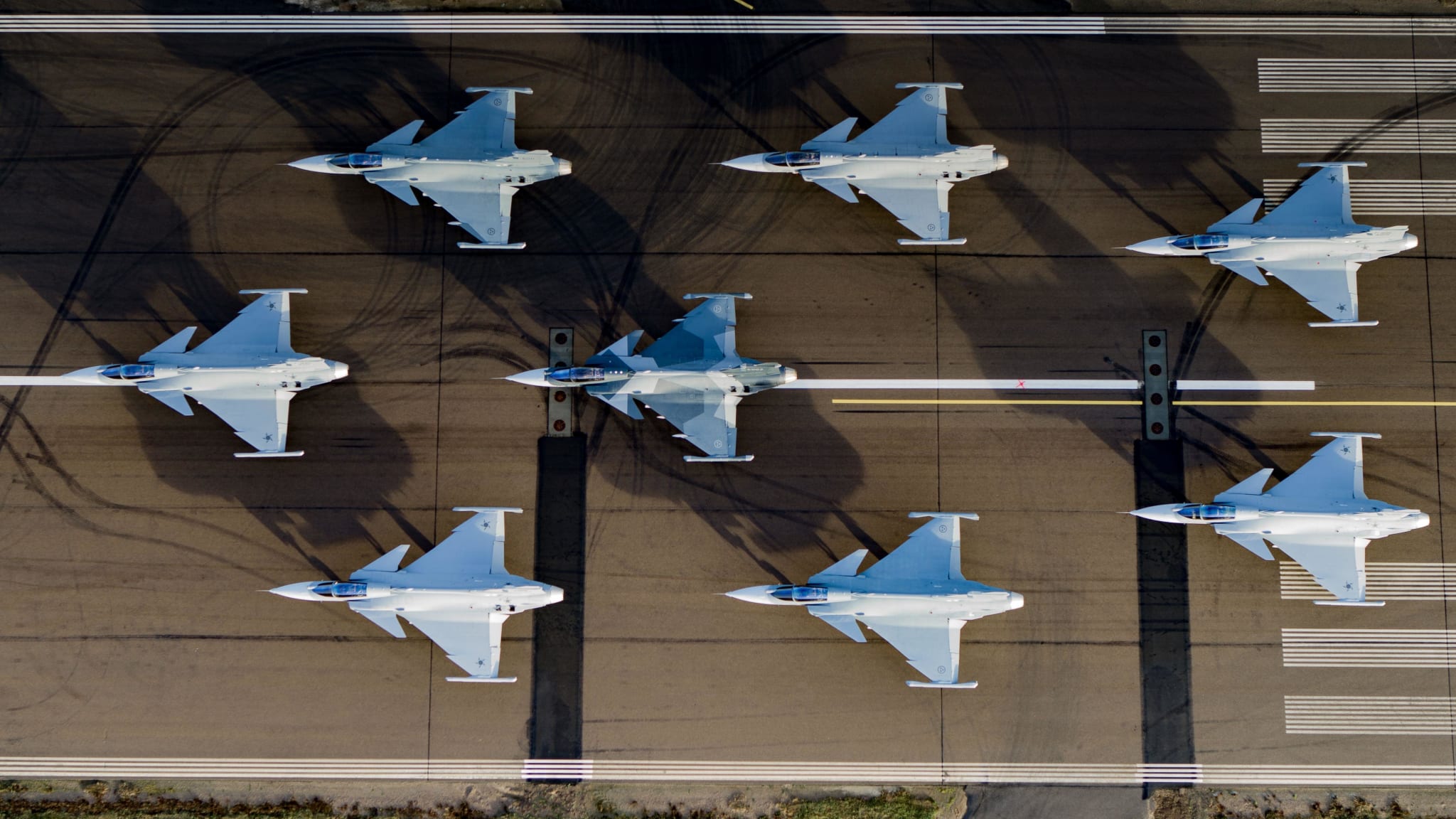 Drone photo of serial Gripen E jet fighters.