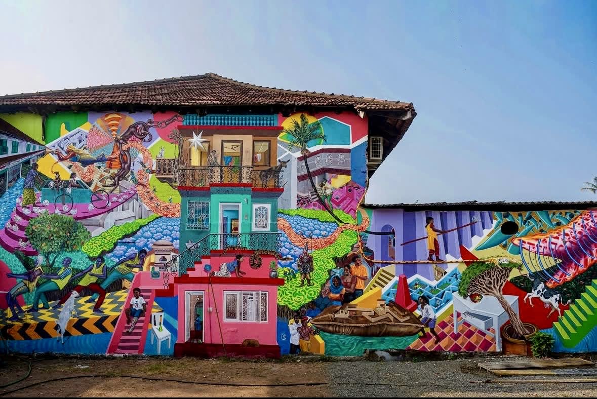 massive colourful mural covering old building