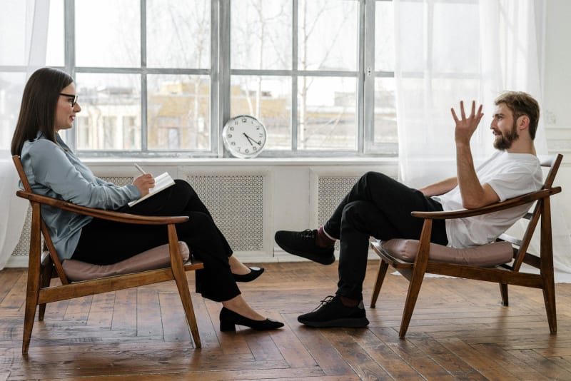 A photo showing a CBT psychotherapist and her client