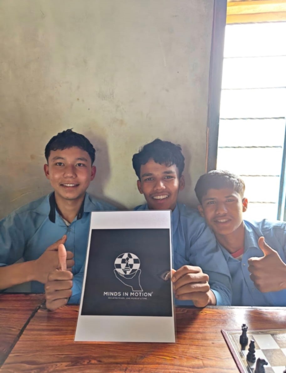 Students celebrating with their Minds in Motion chess set