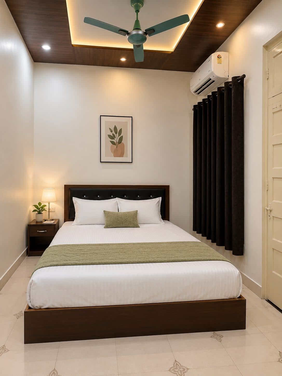 Bedroom 3 — Sage Green Suite with double bed, olive/sage accents, cove ceiling lighting, AC, and dark curtains