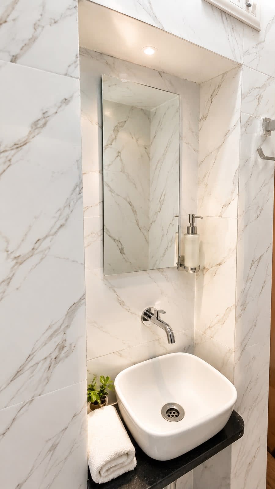 Vanity Washbasin & Mirror — Illuminated vanity niche with vessel sink, wall mixer, vanity mirror, and spotlight
