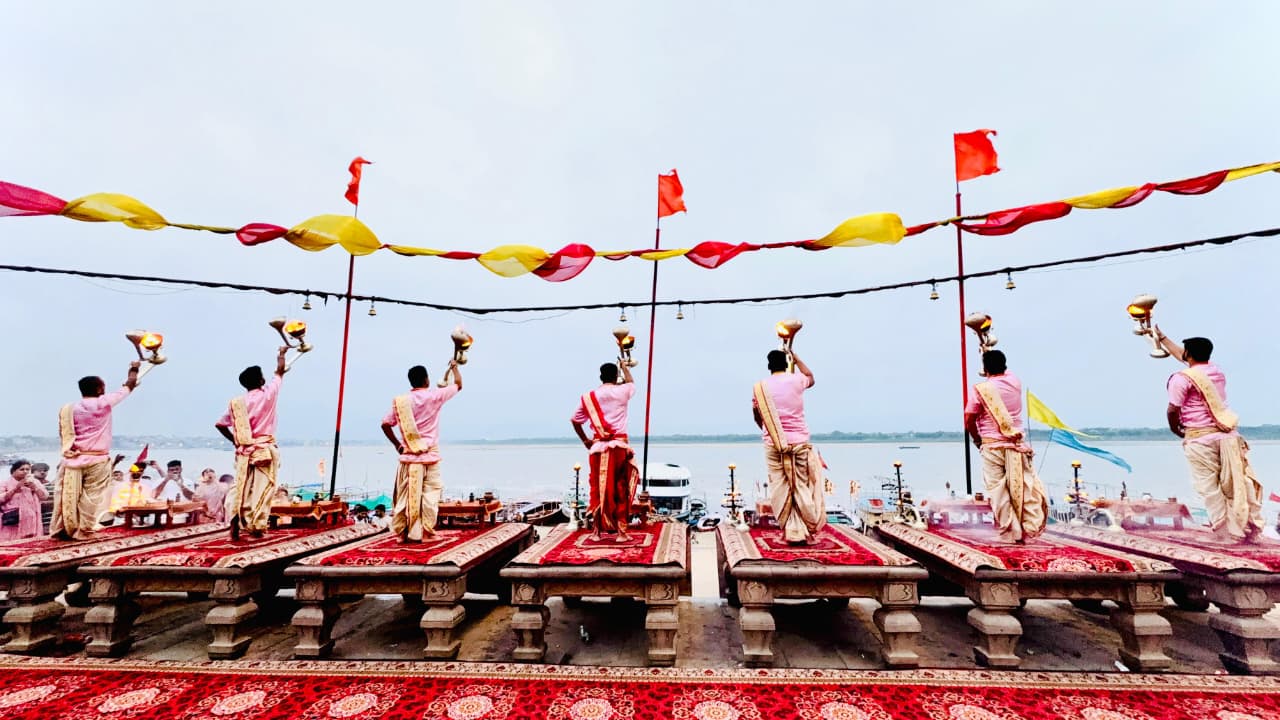 Evening Ganga Aarti with brass lamps and priests