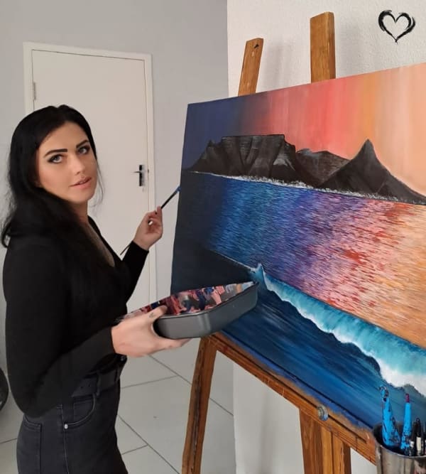 Anneke Jooste painting in her studio