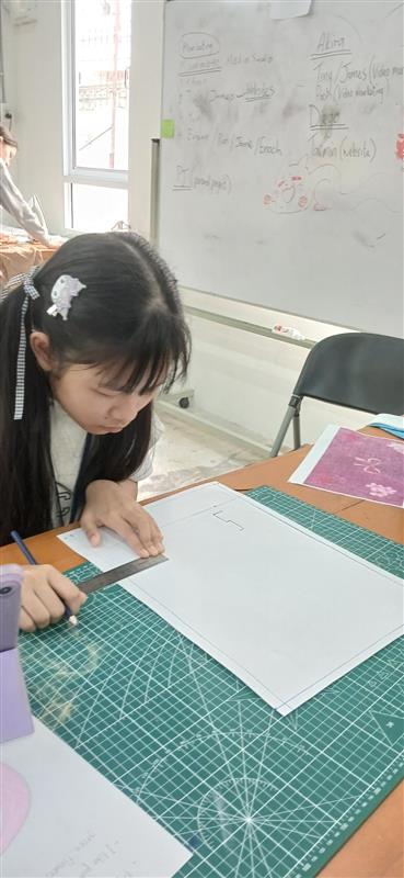 A student working on a digital fashion design.
