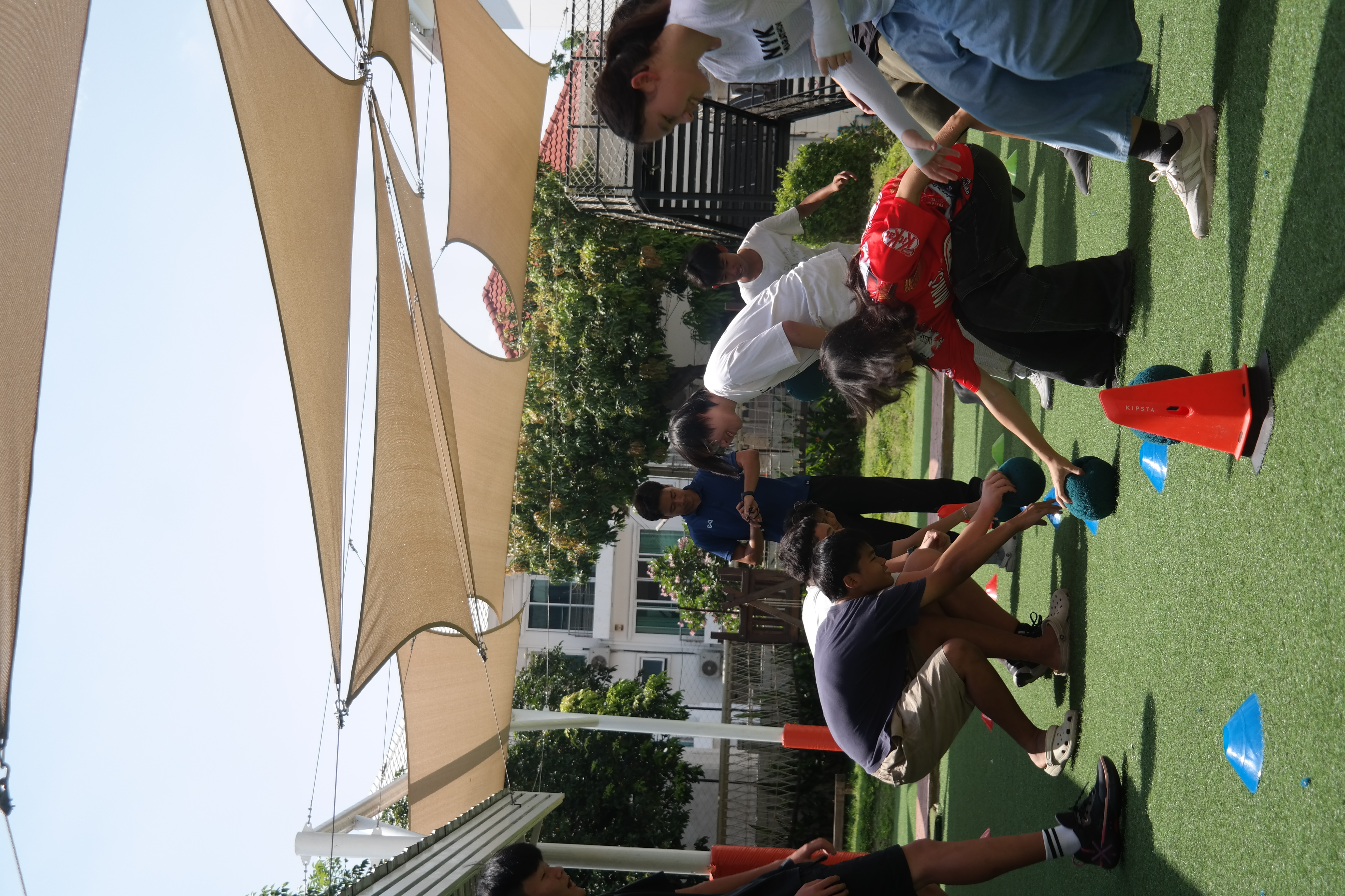 Students playing table tennis.
