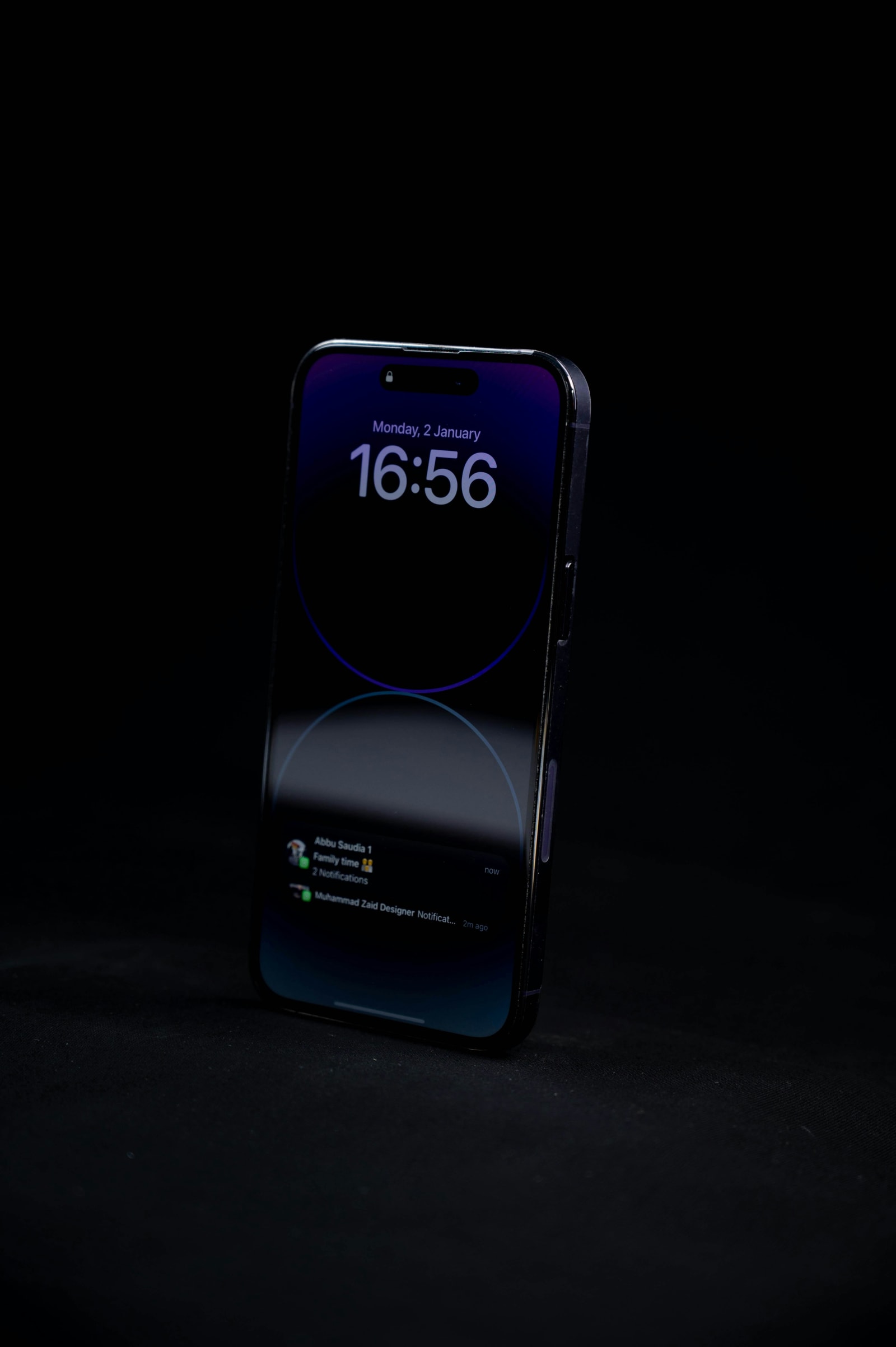 Smartphone on a dark background showing lock-screen notifications