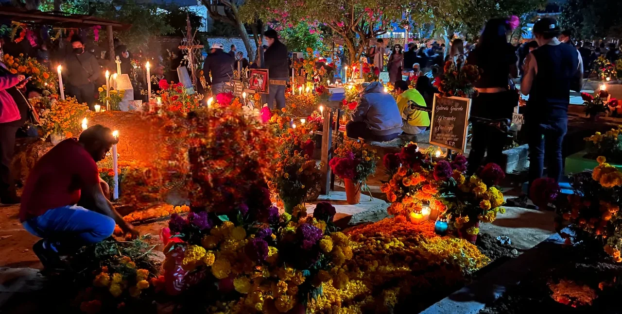 An Oaxacan cemetery during Day of the Dead. Image not property of the author; used for illustrative purposes.
