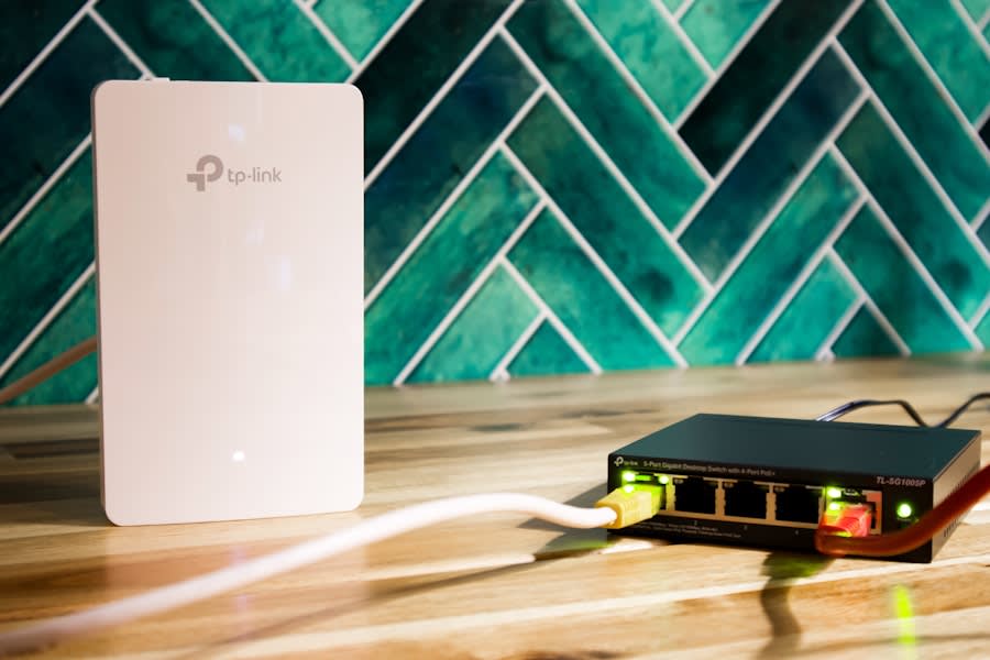 Wi-Fi router beside a network switch