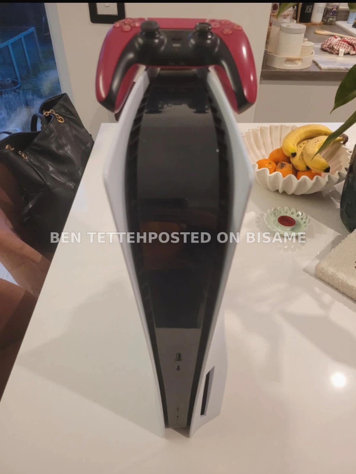 Sony PlayStation 5 console with a Red DualSense Controller 