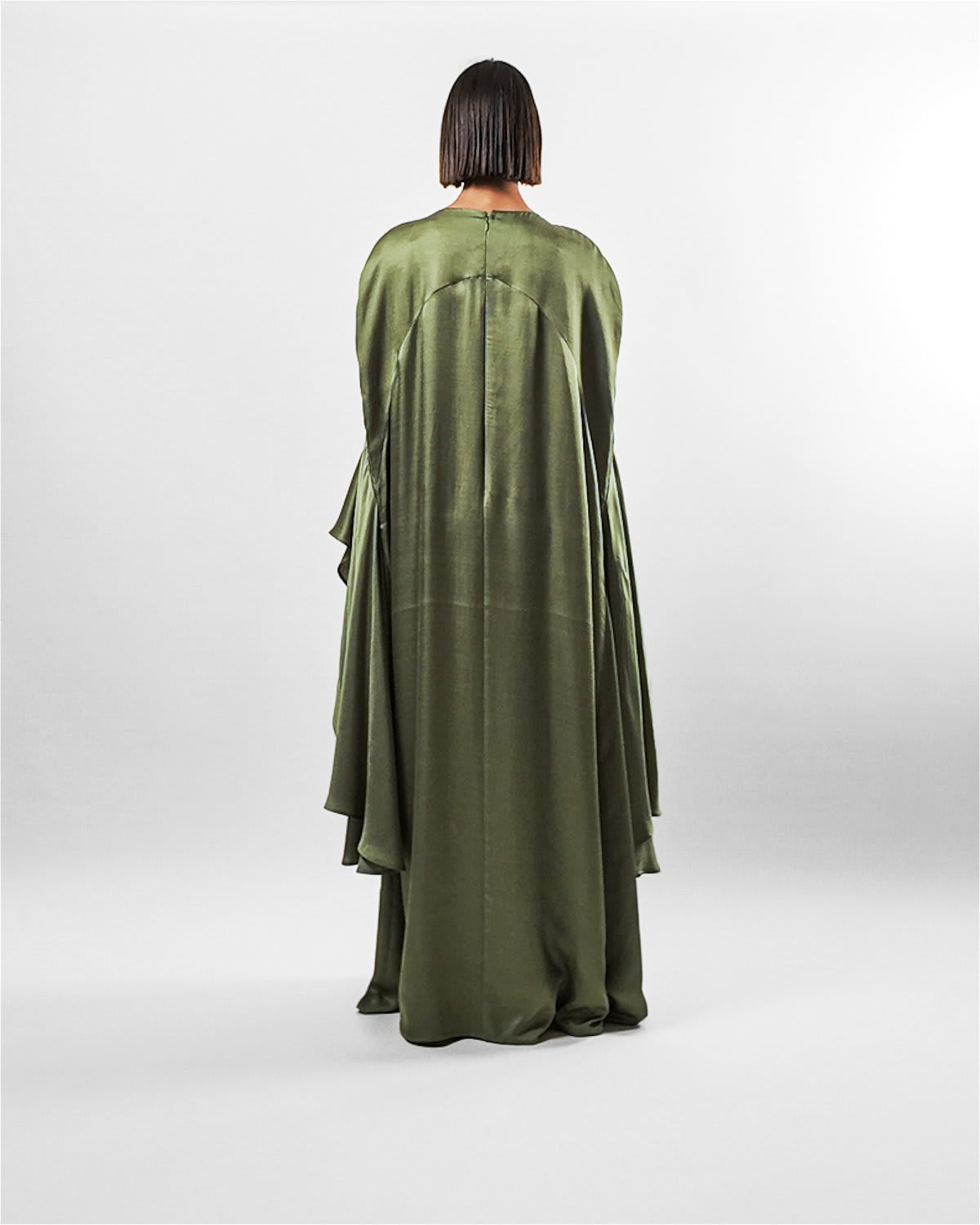 ecuca kaftan Tanisha Rada model wearing the Ecuca Kaftan in Olive Green Eucalyptus Fabric, featuring statement sleeves and embellished neckline. back view.