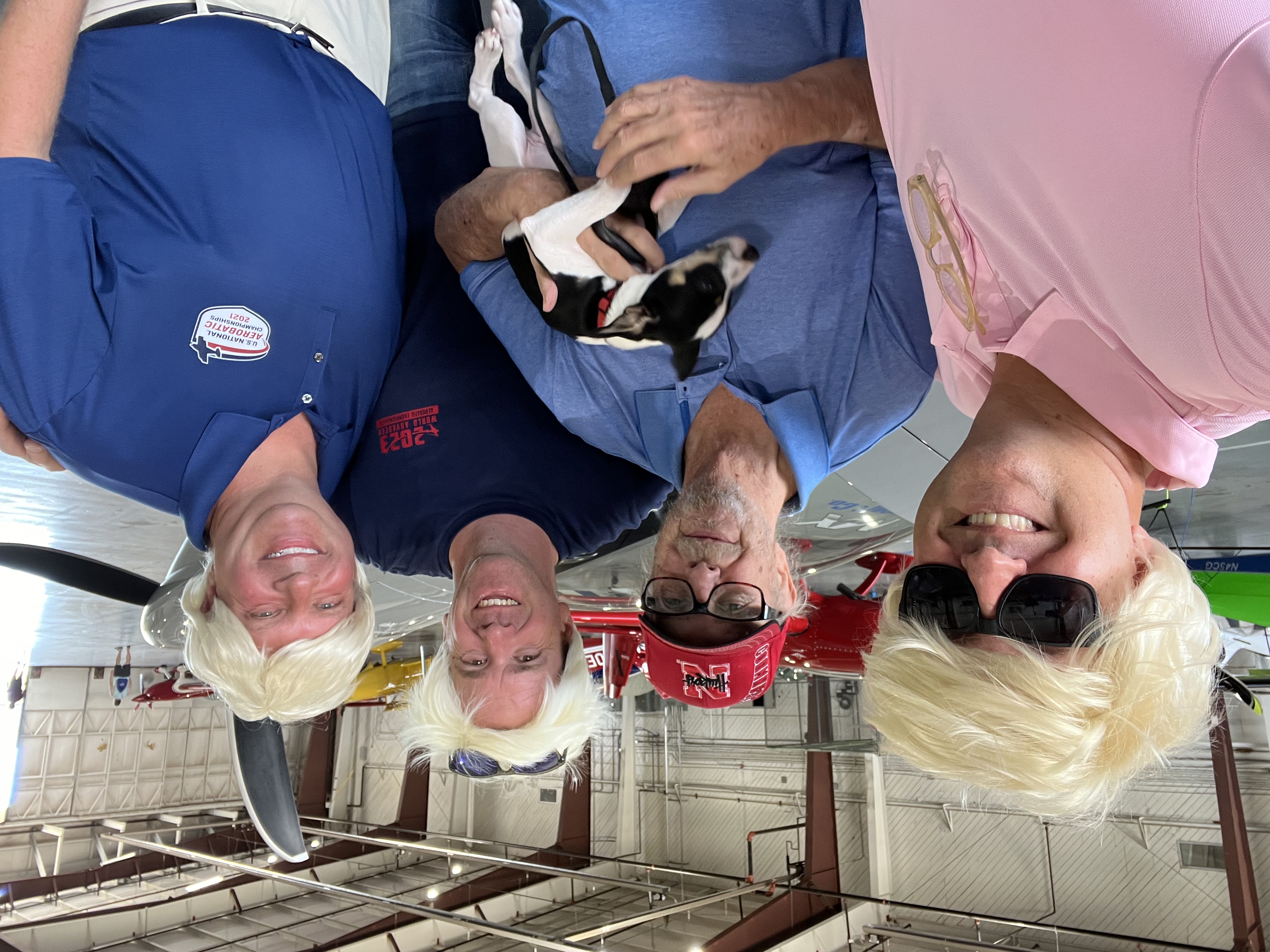 My very confused dad and his dog Sherman graciously pose for a picture with three Kens.