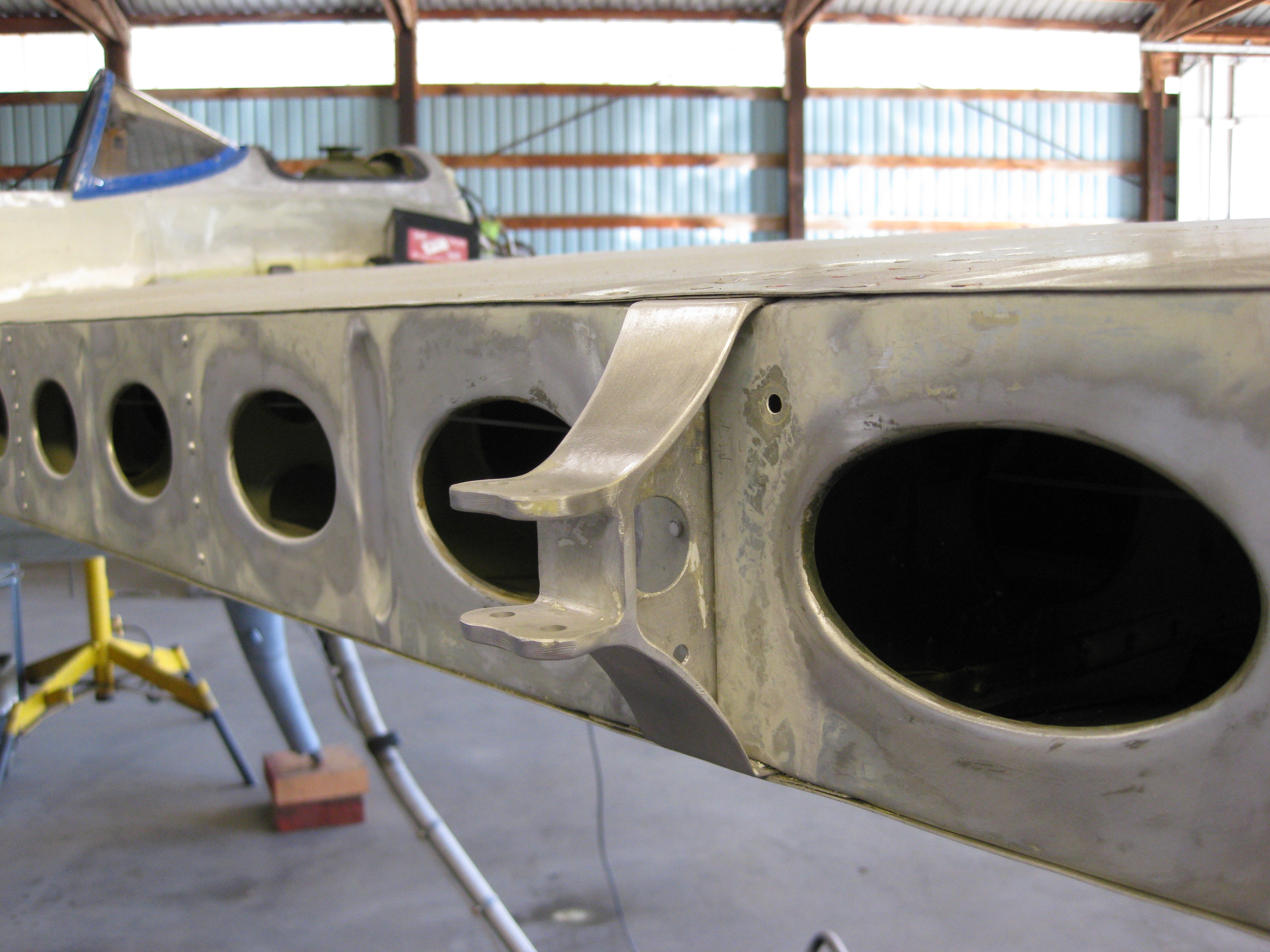 Wing spar stripped to bare metal during restoration