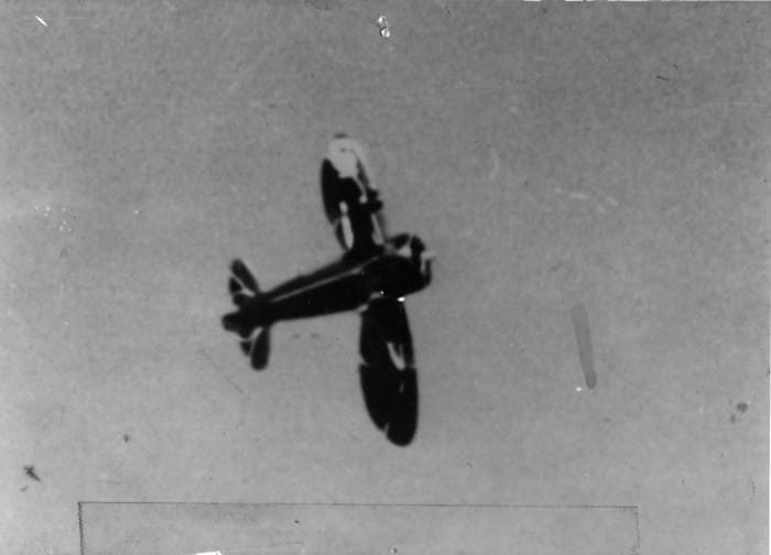 Hall Bulldog in knife-edge flight showing wing sweepback from below