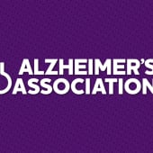 White stacked alz logo with purple background