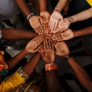 Many hands together with palms up Many hands together with palms up