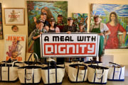 Group in front of bags Group in front of bags