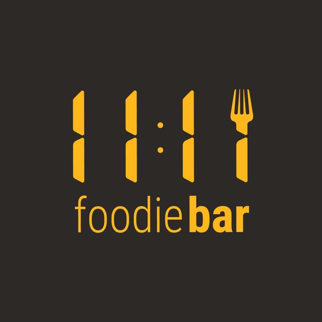 [Logo de 11:11 Foodiebar]