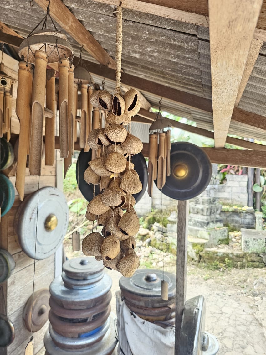 Inspecting handmade pieces at a Balinese workshop