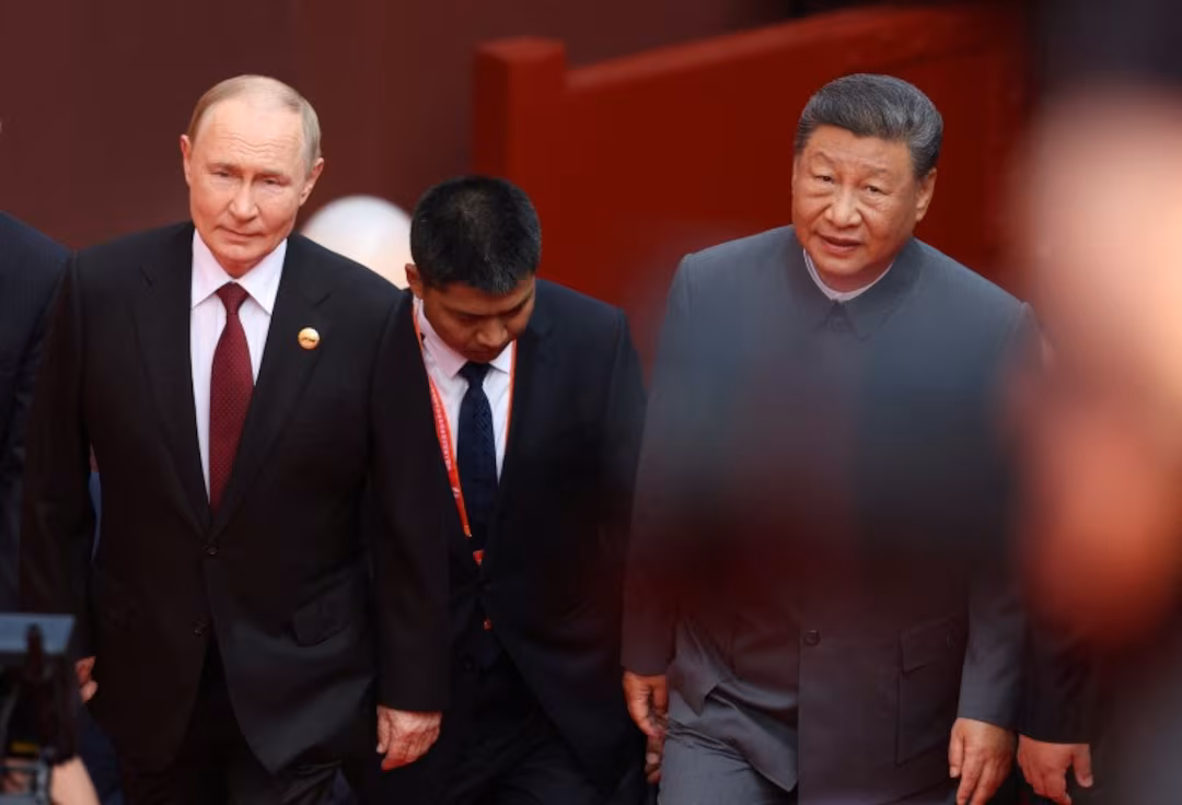 Xi to Host Putin as China Signals Stability After Trump Visit