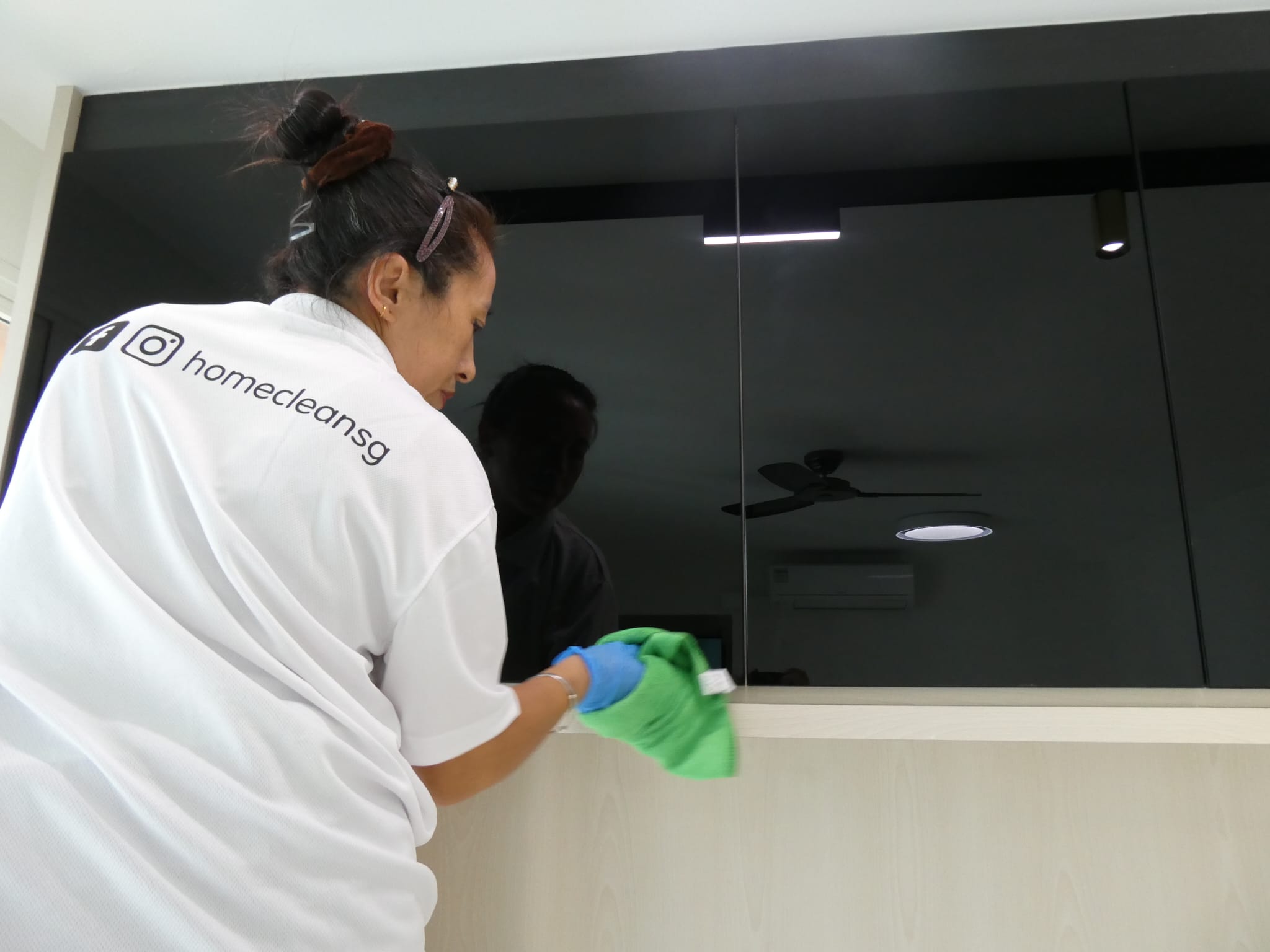 ASC cleaner mopping floor in Singapore home