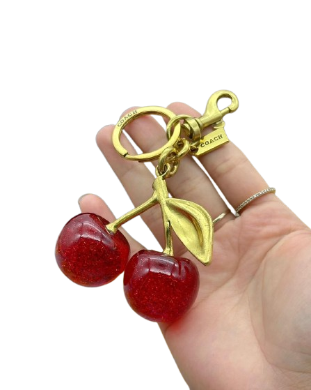 Coach – Llavero Cherry Gold Edition (Dama)