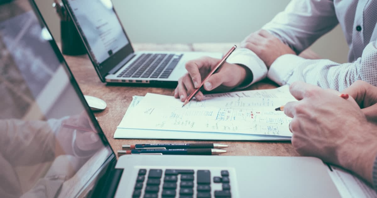 Self-employed borrower reviewing home loan documents with Sydney mortgage broker