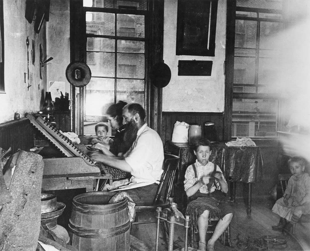 Bohemian Cigarmakers at work in their Tenement